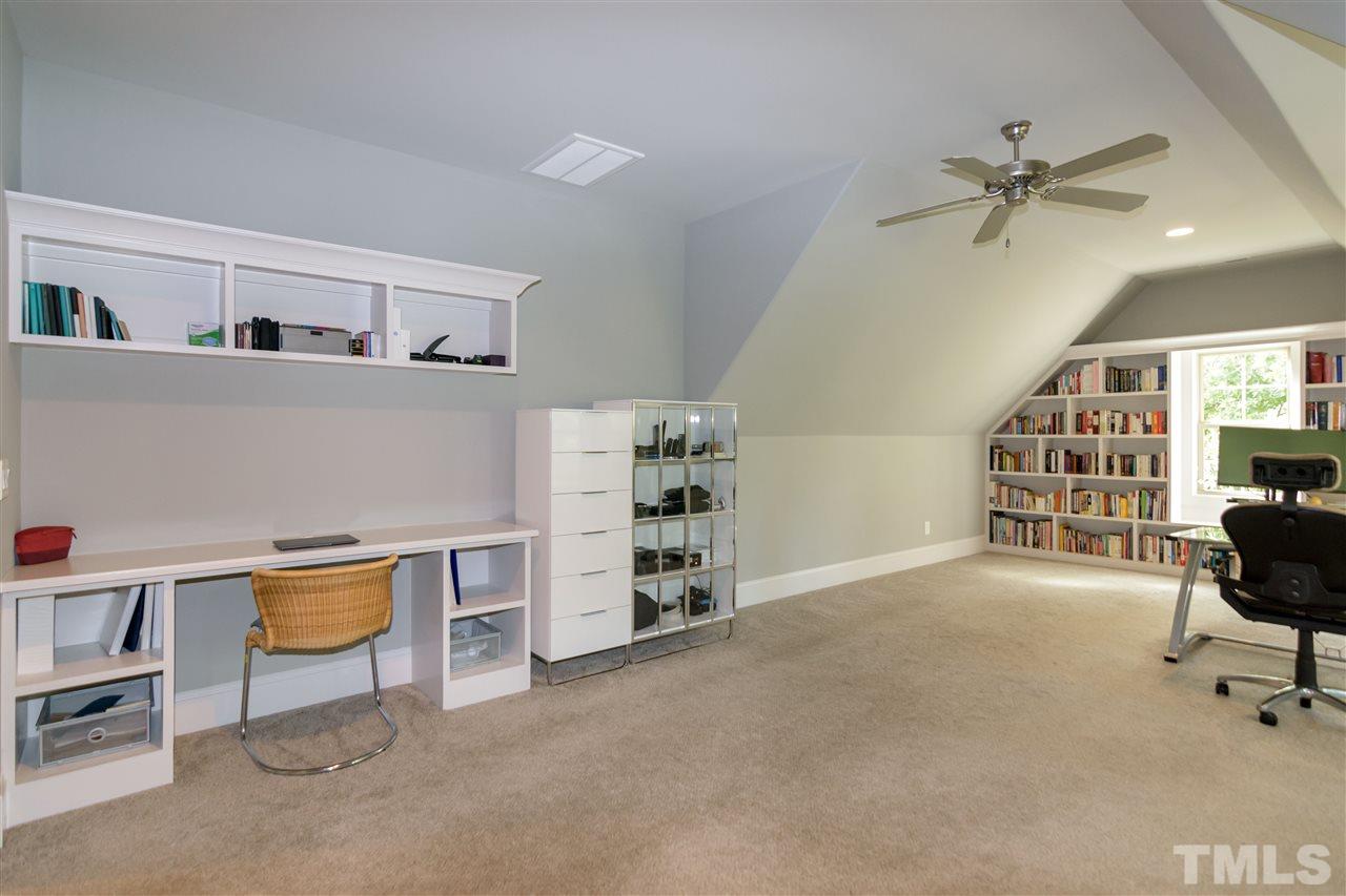 1216 Hunting Ridge Road Raleigh, NC 27615 - Photo 23 of 30 a view of a livingroom with furniture and staircase
