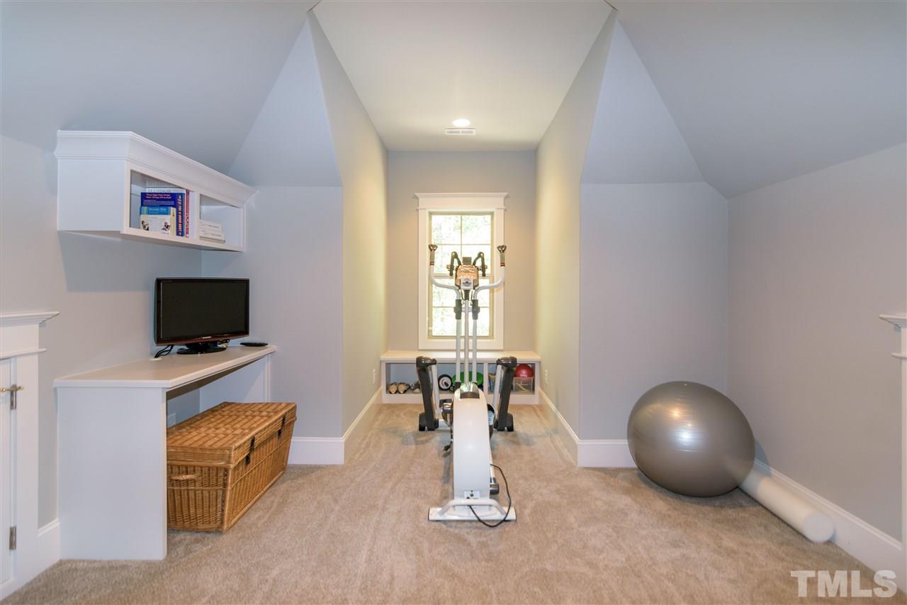 1216 Hunting Ridge Road Raleigh, NC 27615 - Photo 24 of 30 a room with furniture and a flat screen tv