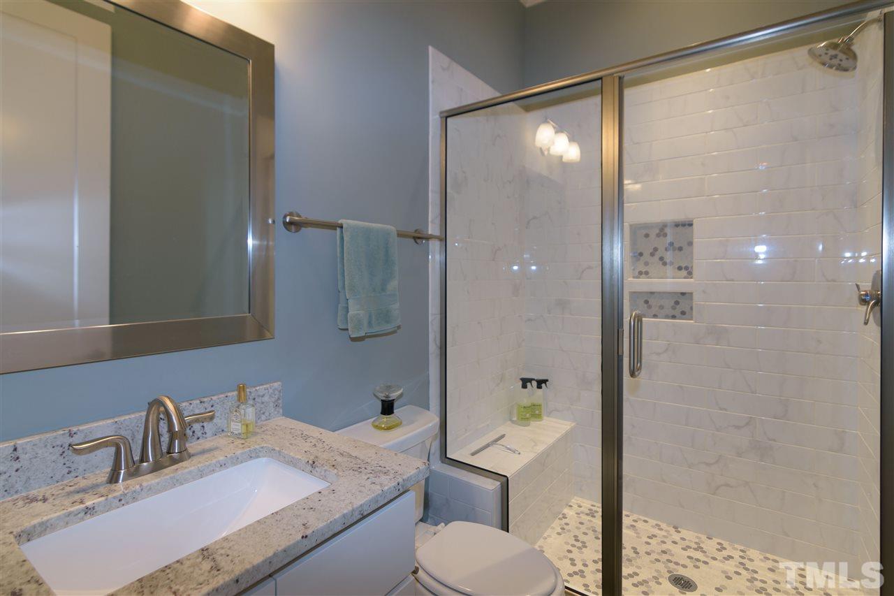 1216 Hunting Ridge Road Raleigh, NC 27615 - Photo 26 of 30 a bathroom with a sink toilet and shower