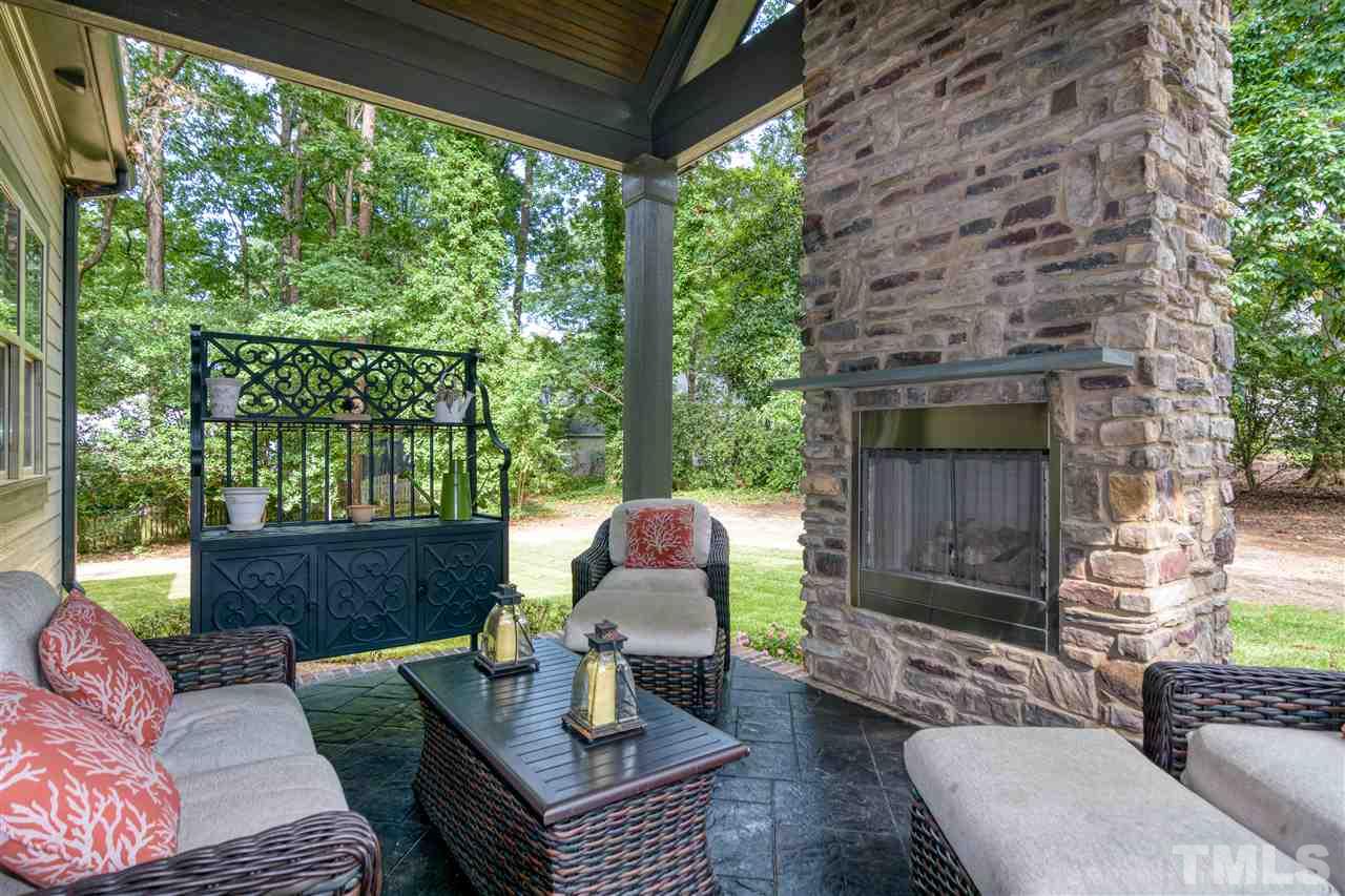 1216 Hunting Ridge Road Raleigh, NC 27615 - Photo 27 of 30 a outdoor living space with furniture and a fireplace