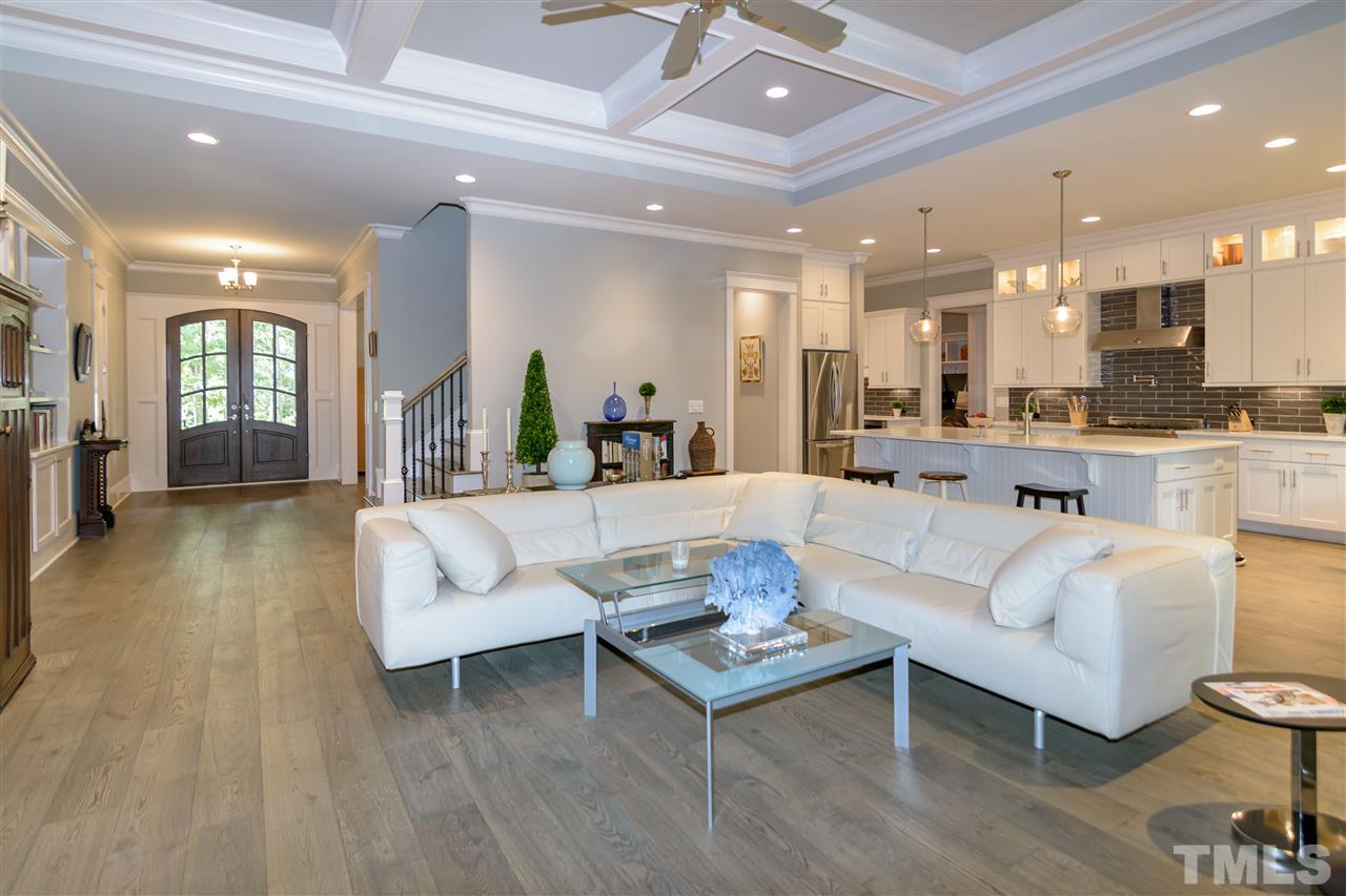 1216 Hunting Ridge Road Raleigh, NC 27615 - Photo 5 of 30 a living room with furniture kitchen view and a wooden floor