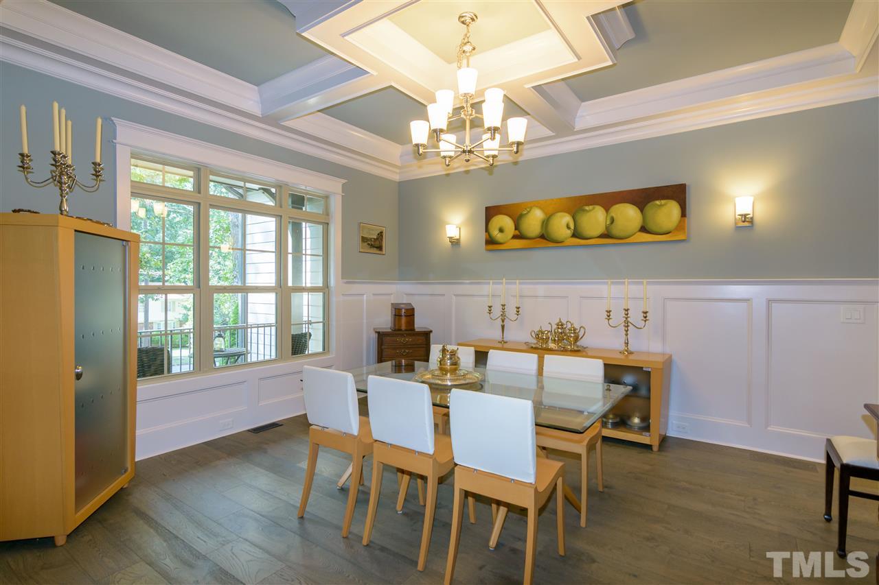 1216 Hunting Ridge Road Raleigh, NC 27615 - Photo 7 of 30 a view of a dining room with furniture and a chandelier