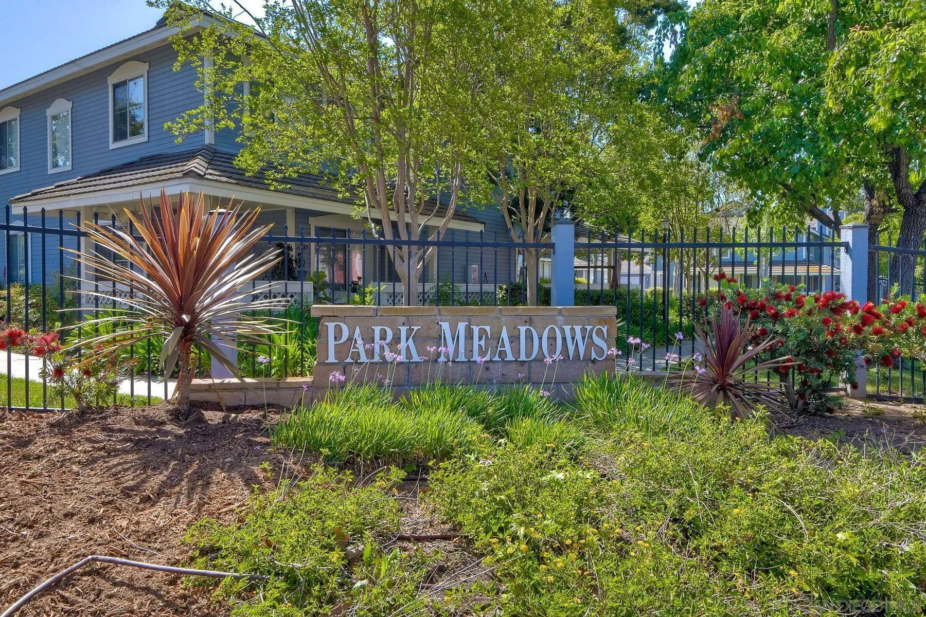 13933 Midland Road Poway, CA 92064 - Photo 2 of 42 a view of a street sign under a large tree