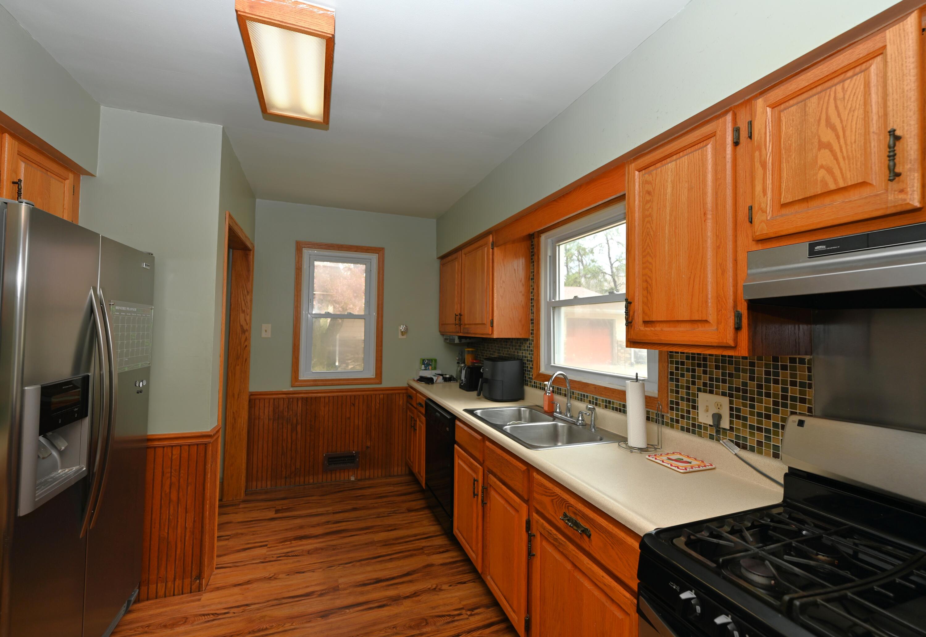 5110 West 400 North Winamac, IN 46996 - Photo 23 of 35 a kitchen with stainless steel appliances a sink stove and cabinets