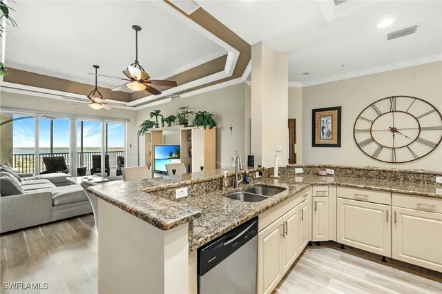 a kitchen with a sink and a stove top oven