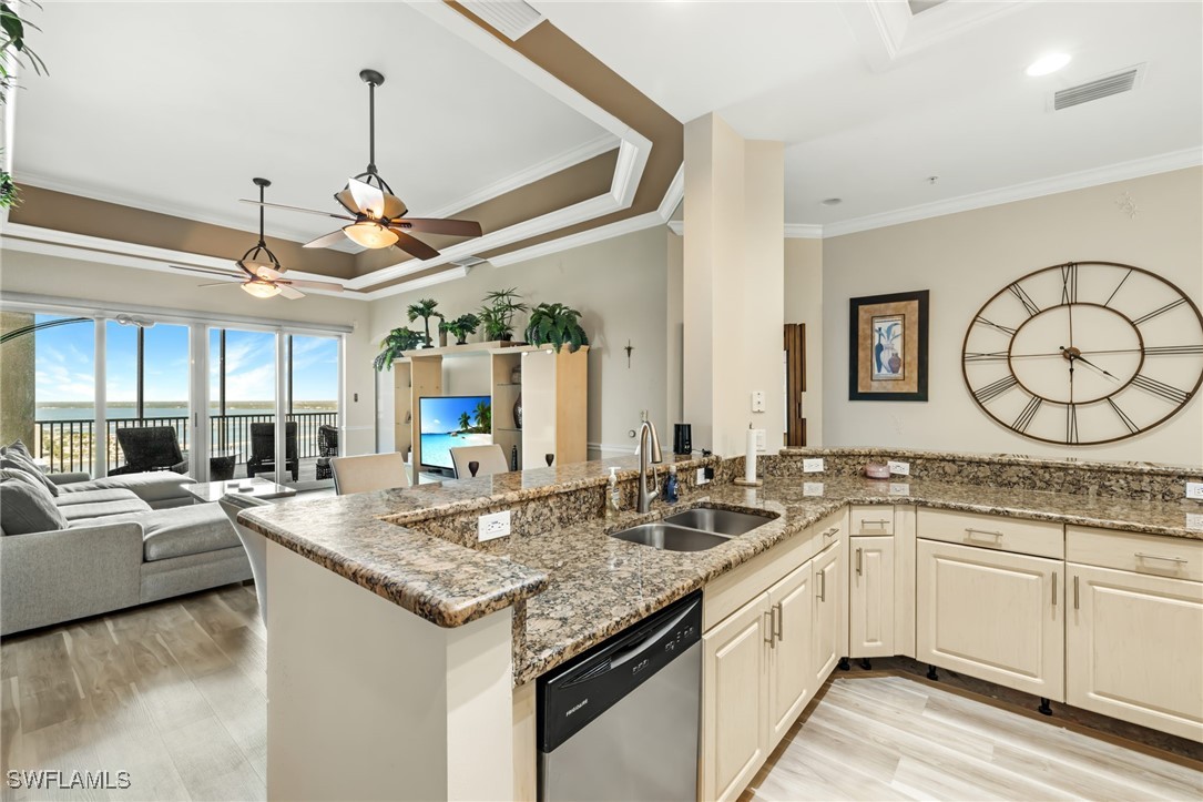 2745 First Street, Unit 2703 Fort Myers, FL 33916 - Photo 12 of 34 a kitchen with a sink and a stove top oven