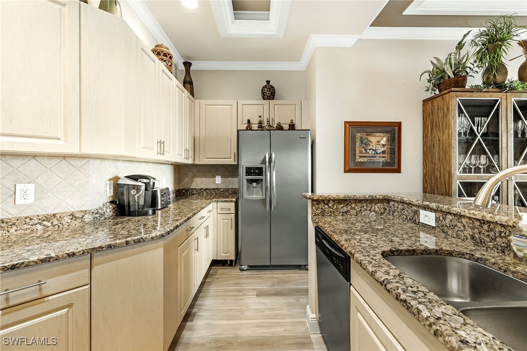 2745 First Street, Unit 2703 Fort Myers, FL 33916 - Photo 13 of 34 a kitchen with stainless steel appliances granite countertop a sink stove and refrigerator