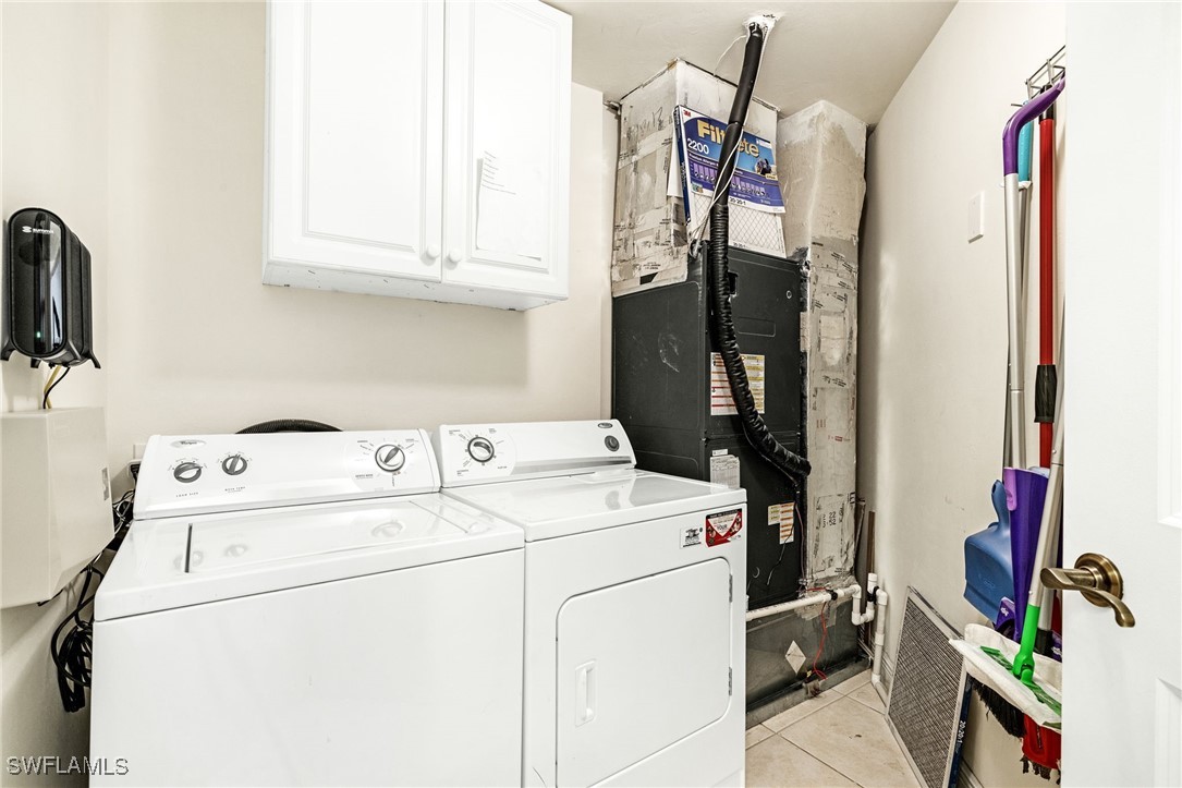 2745 First Street, Unit 2703 Fort Myers, FL 33916 - Photo 18 of 34 a utility room with dryer and washer