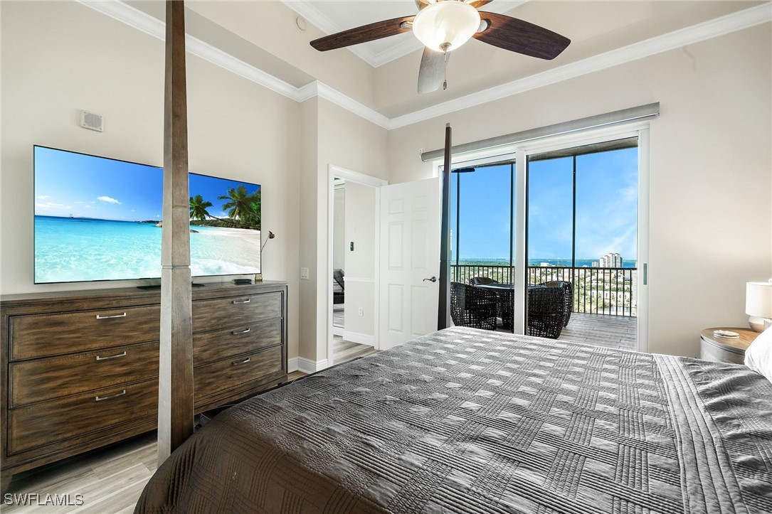 2745 First Street, Unit 2703 Fort Myers, FL 33916 - Photo 26 of 34 a bedroom with a bed and a large mirror