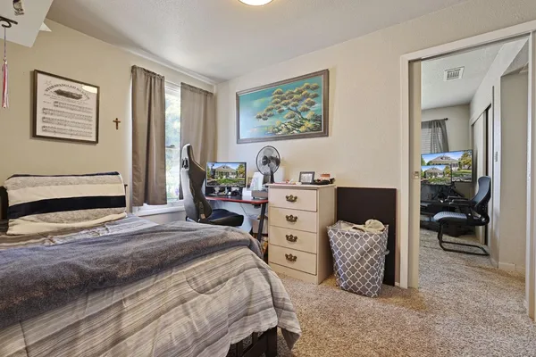 a bedroom with a bed and furniture