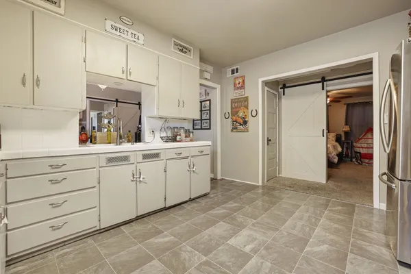 a view of a kitchen with cabinets