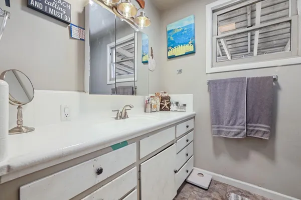 a bathroom with a sink and a mirror