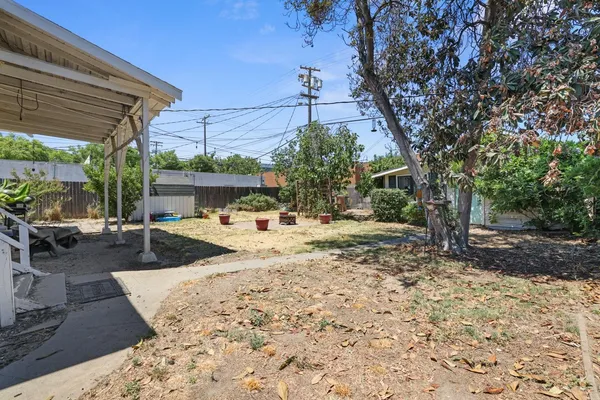 a view of a backyard with a patio