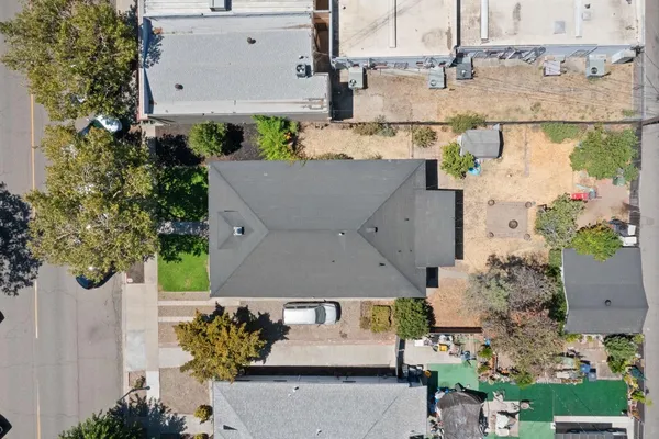 an aerial view of multiple houses with outdoor space