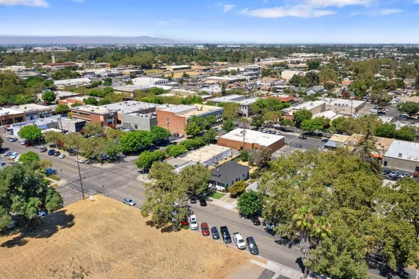 an aerial view of residential houses with outdoor space