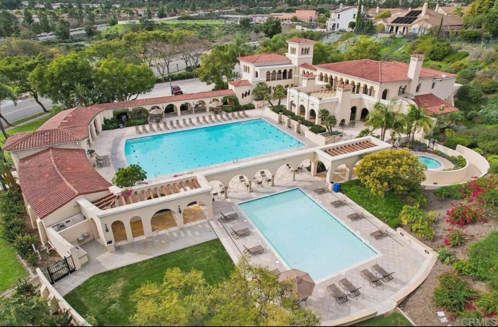 1234 Old Janal Ranch Road Chula Vista, CA 91915 - Photo 4 of 34 an aerial view of a house with a garden and swimming pool