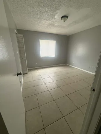 a view of an empty room and a window