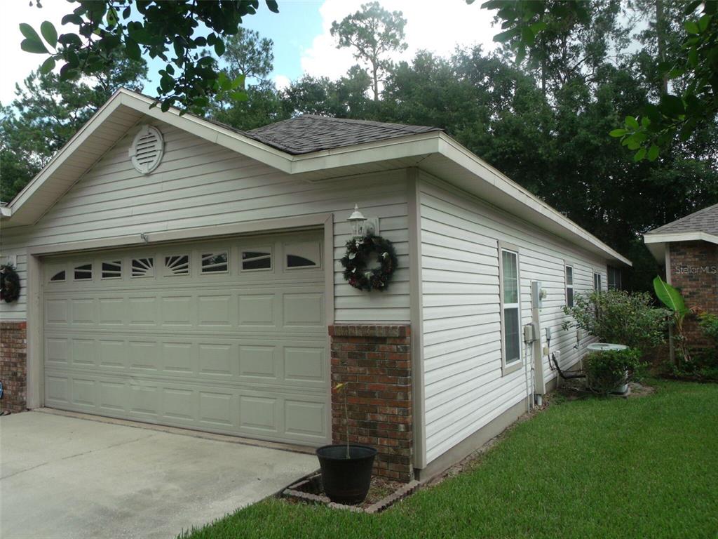 4824 Northwest 80th Road Gainesville, FL 32653 - Photo 1 of 15 a view of a small house with yard