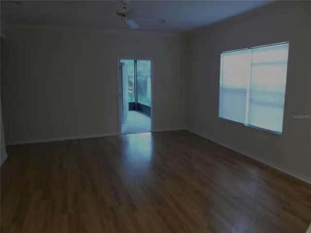a kitchen with stainless steel appliances white cabinets and a refrigerator