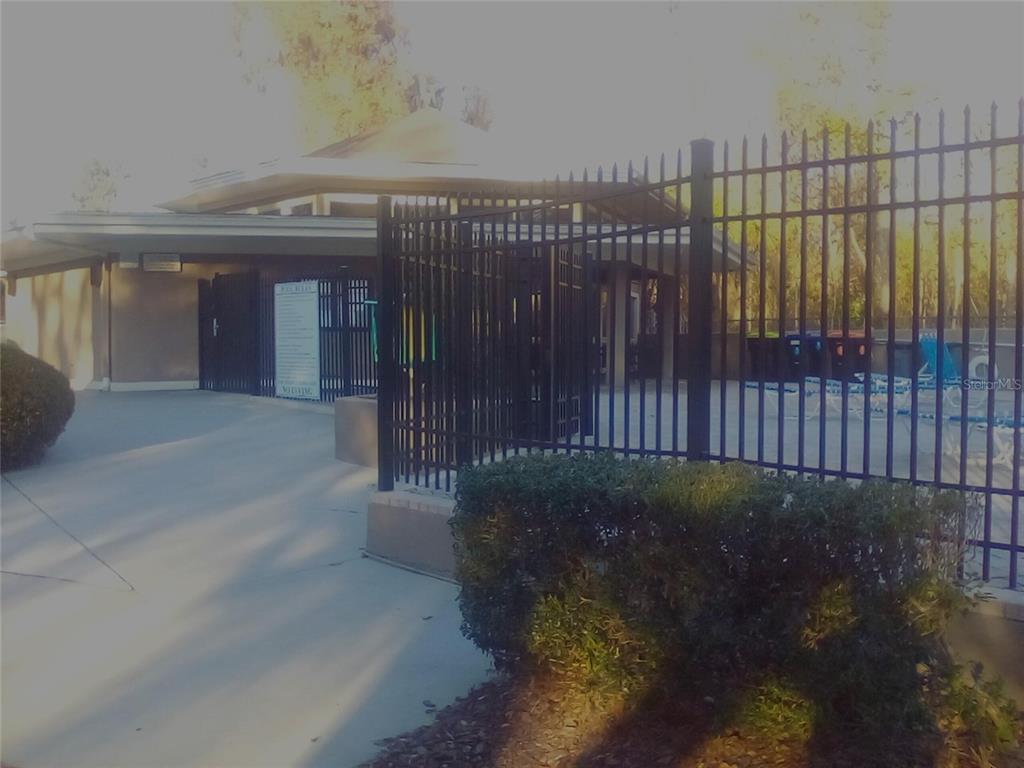 4824 Northwest 80th Road Gainesville, FL 32653 - Photo 6 of 15 a view of a porch with a wooden fence