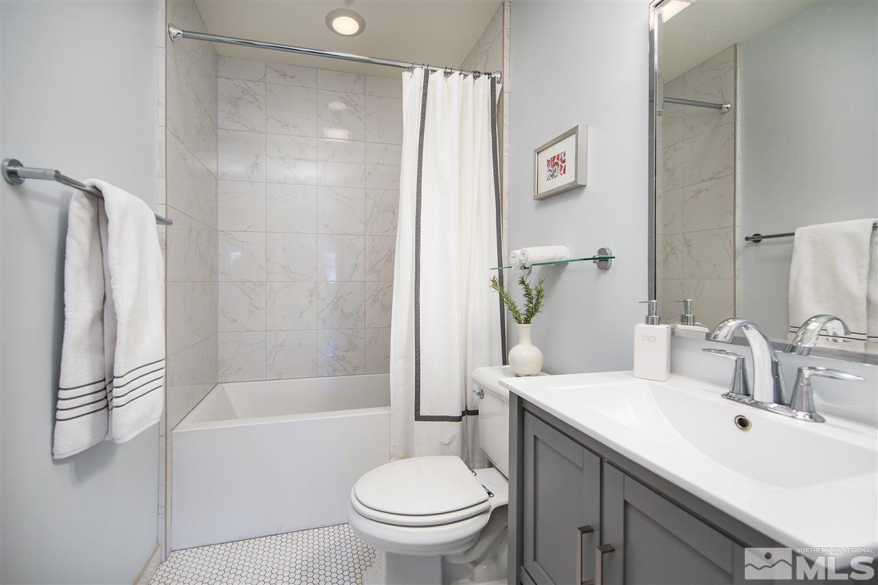 613 Gordon Avenue Reno, NV 89509 - Photo 13 of 16 a bathroom with a sink toilet and shower