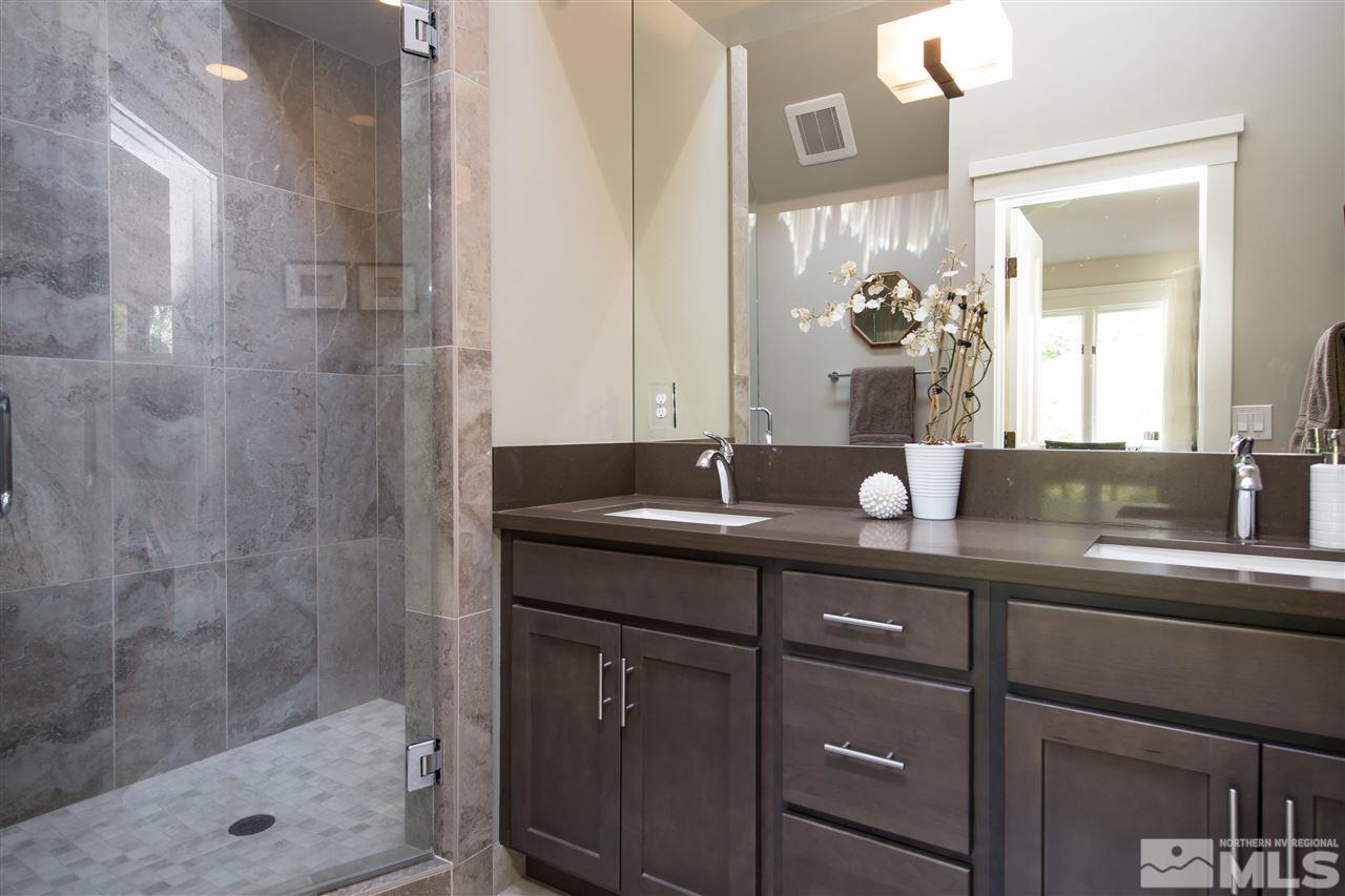 613 Gordon Avenue Reno, NV 89509 - Photo 10 of 16 a bathroom with a sink and a mirror