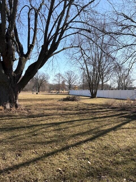 9225 Liable Road Highland, IN 46322 - Photo 3 of 7 a view of dirt yard with a large tree