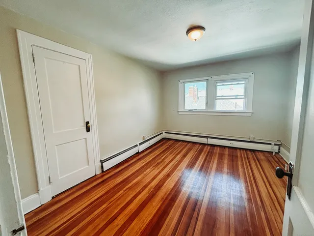 a view of a car parked in front of house