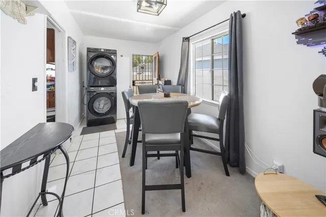 a view of a dining room with furniture and window