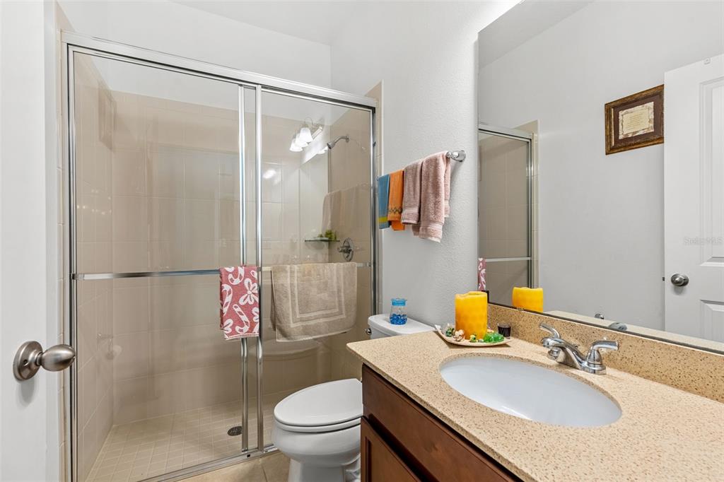 2085 Lula Road Minneola, FL 34715 - Photo 23 of 39 a bathroom with a sink toilet and shower