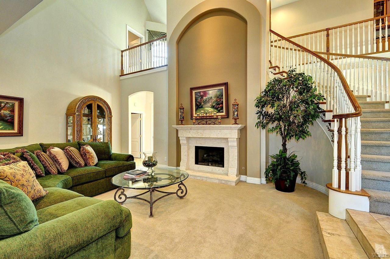 2371 Duval Road Camarillo, CA 93012 - Photo 4 of 50 a living room with furniture a fireplace and potted plants