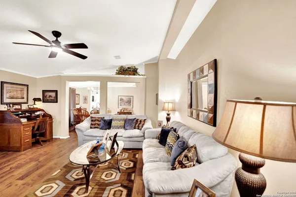 a living room with furniture and a large window