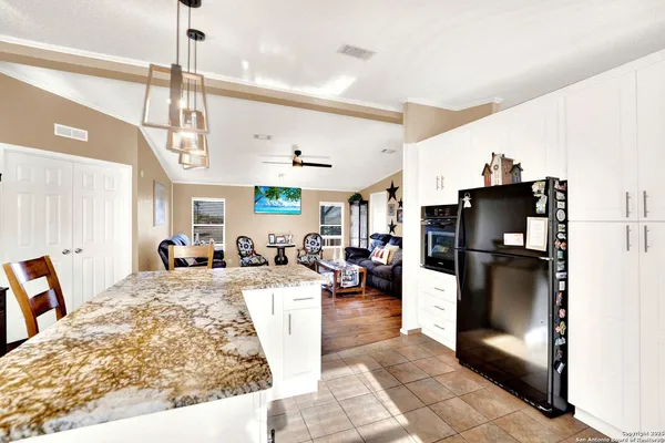 a living room with a couch and a chandelier