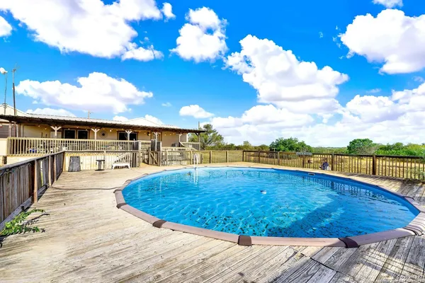 a view of a swimming pool with a lounge chairs