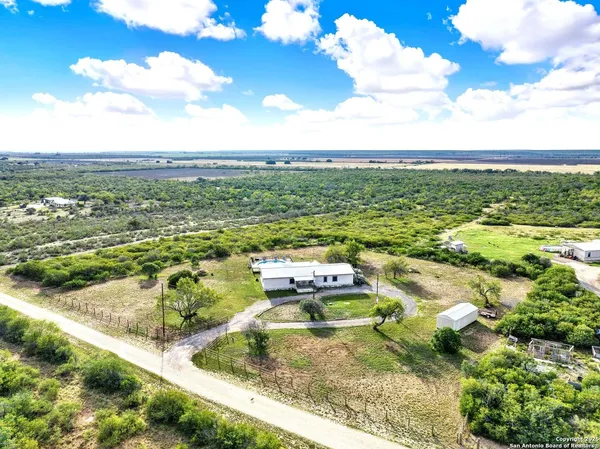 a view of a water house with a big yard