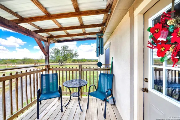 a view of a balcony with furniture