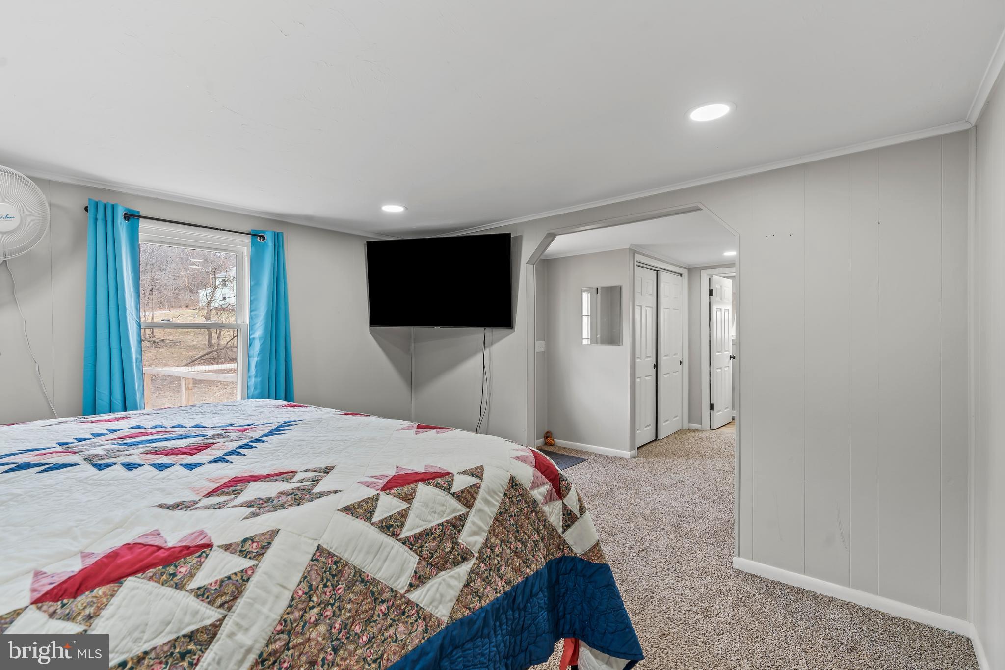 5150 Nursery Road Dover, PA 17315 - Photo 19 of 38 a bedroom with a bed and a flat screen tv