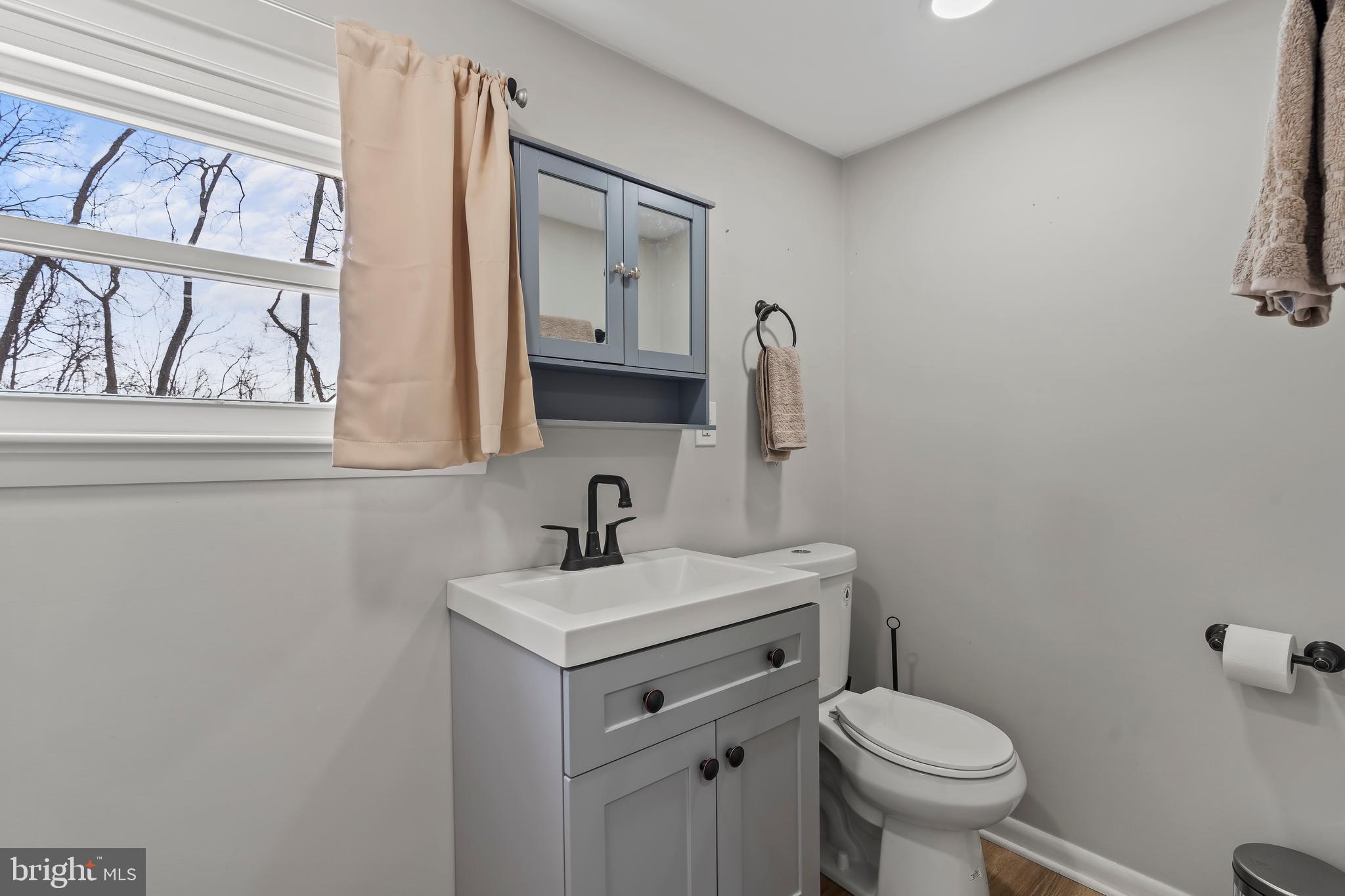 5150 Nursery Road Dover, PA 17315 - Photo 22 of 38 a bathroom with a toilet sink and mirror