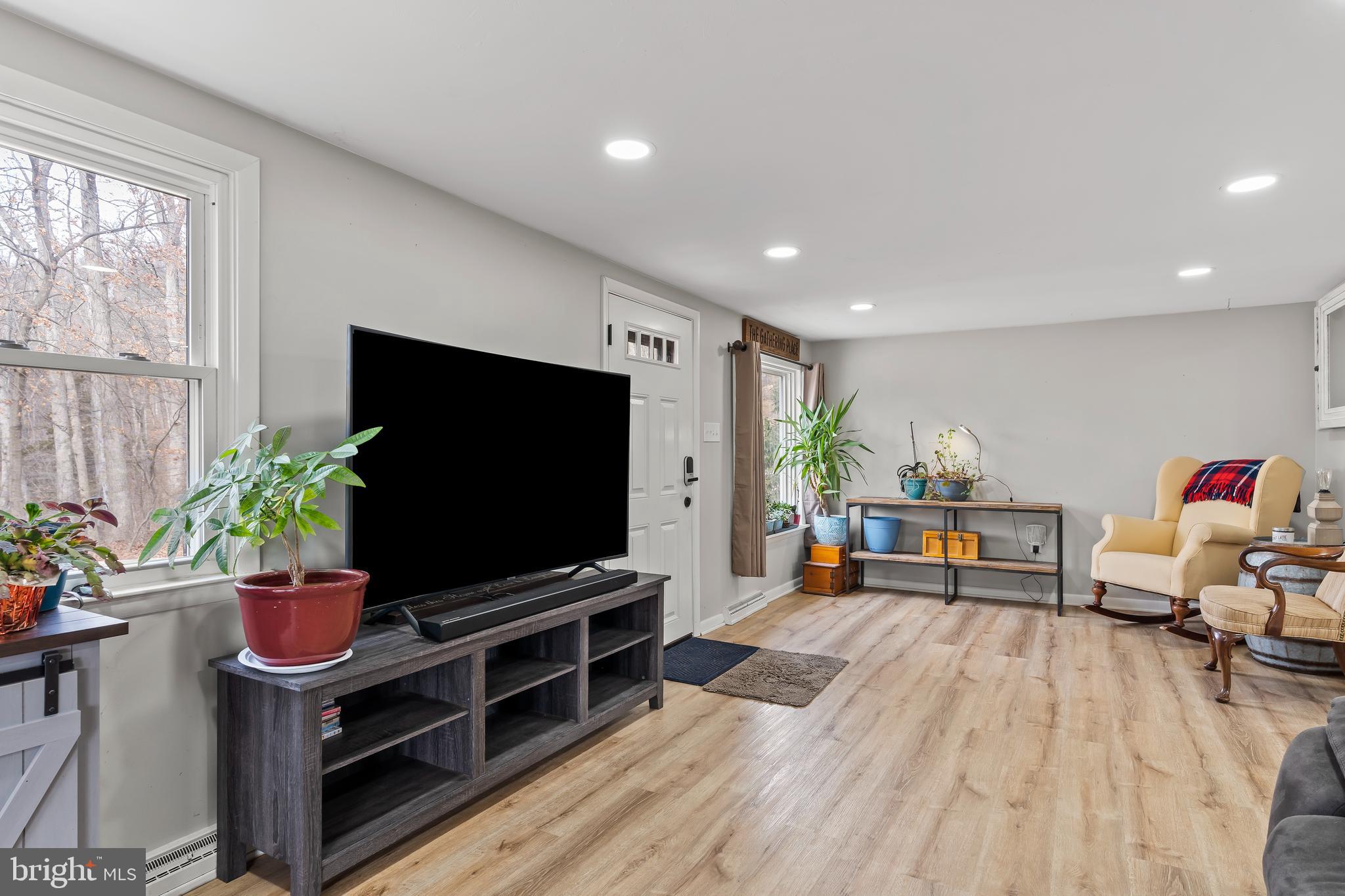 5150 Nursery Road Dover, PA 17315 - Photo 4 of 38 a living room with furniture and a flat screen tv