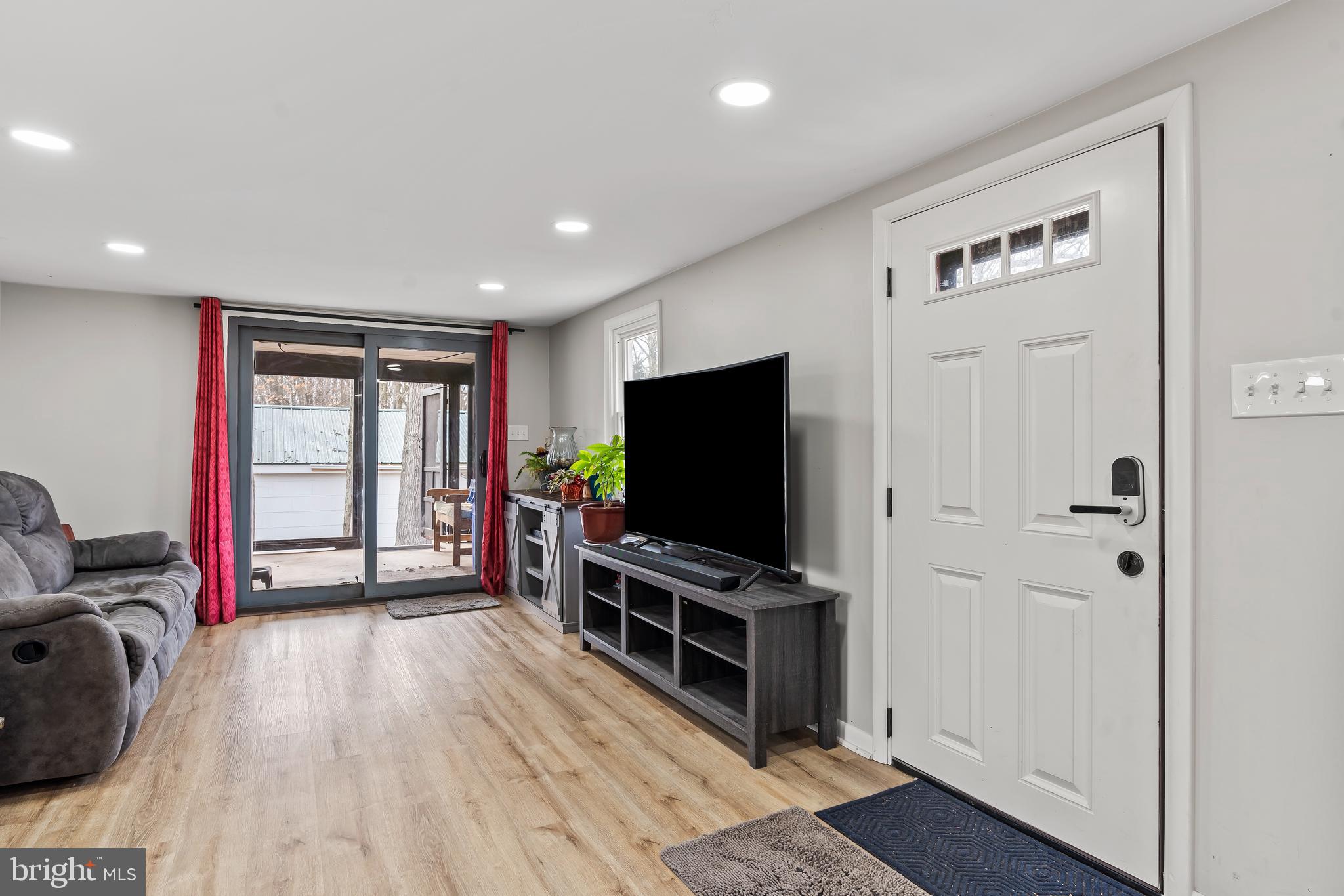 5150 Nursery Road Dover, PA 17315 - Photo 5 of 38 a living room with furniture and a flat screen tv