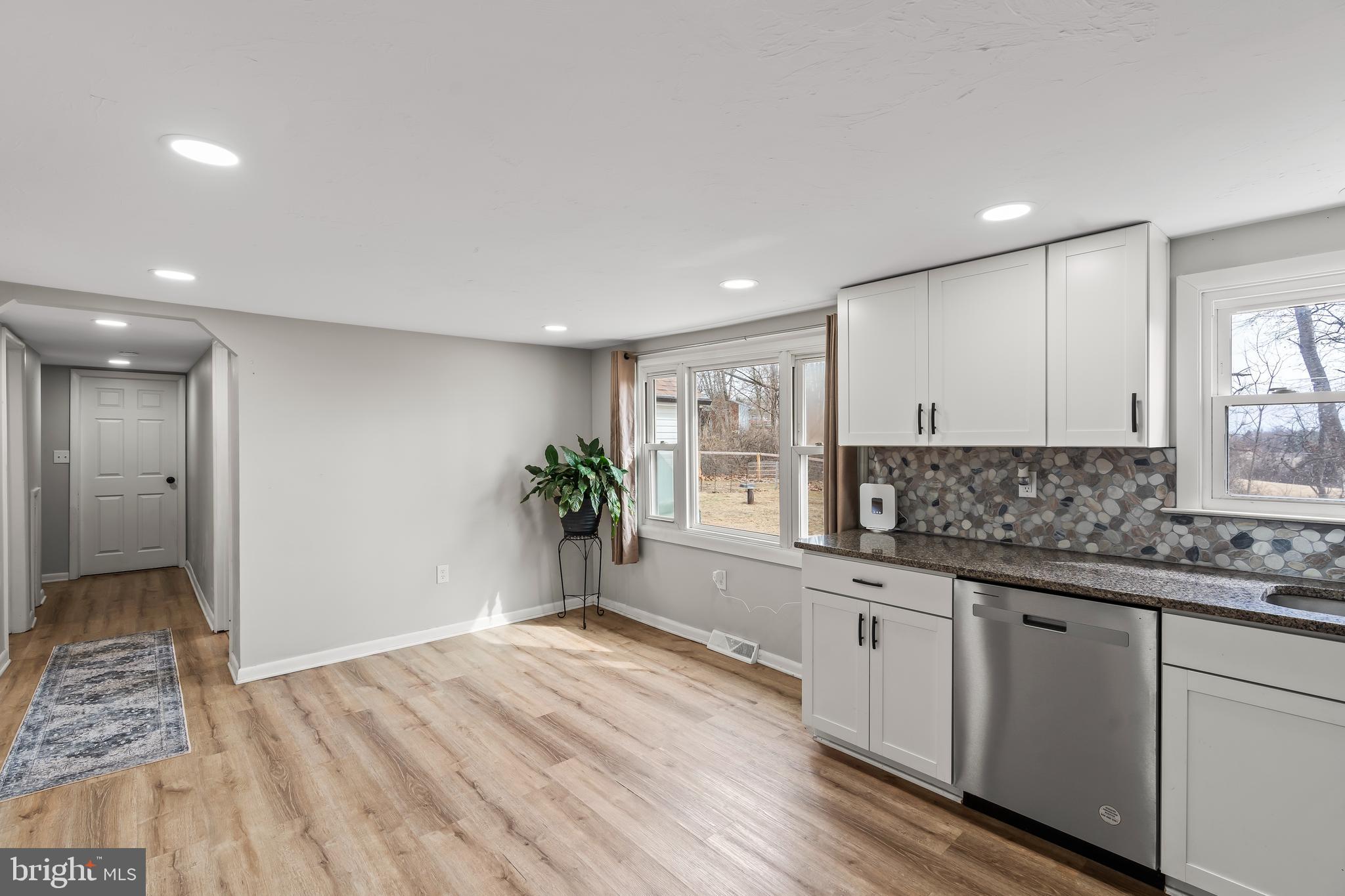 5150 Nursery Road Dover, PA 17315 - Photo 9 of 38 a large kitchen with stainless steel appliances granite countertop a sink and a stove