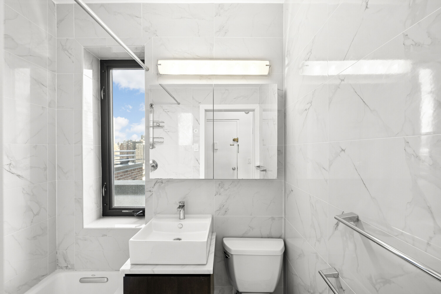 140 West 69th Street, Unit PH1 Manhattan, NY 10023 - Photo 8 of 9 a bathroom with a toilet sink and mirror