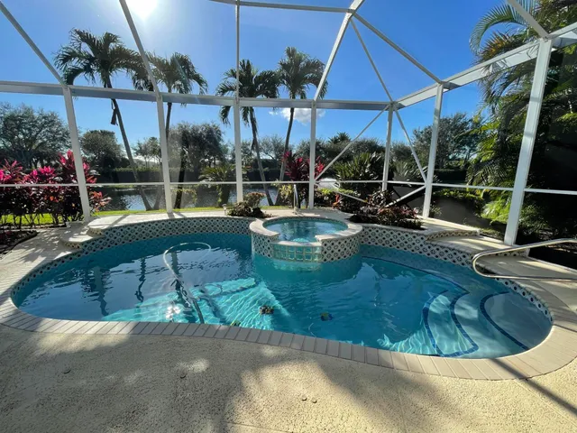 a view of a swimming pool with a patio