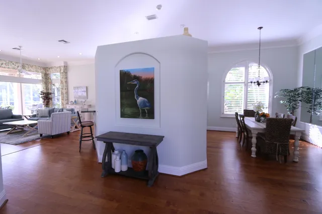 a living room with fireplace furniture and a large window
