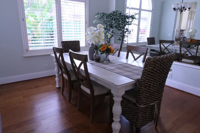 a view of a dining room with furniture window and wooden floor