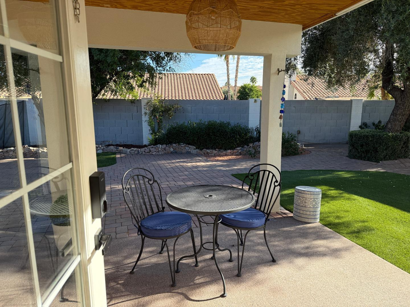 5449 East Phelps Road Scottsdale, AZ 85254 - Photo 27 of 28 a view of a patio with table and chairs with wooden floor and fence