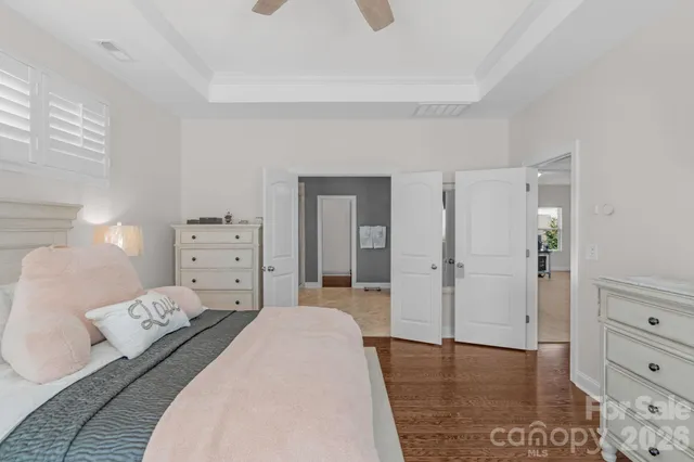 a bedroom with a bed and a dresser