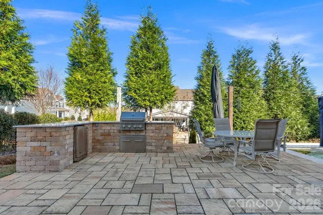 a view of backyard with seating and green space