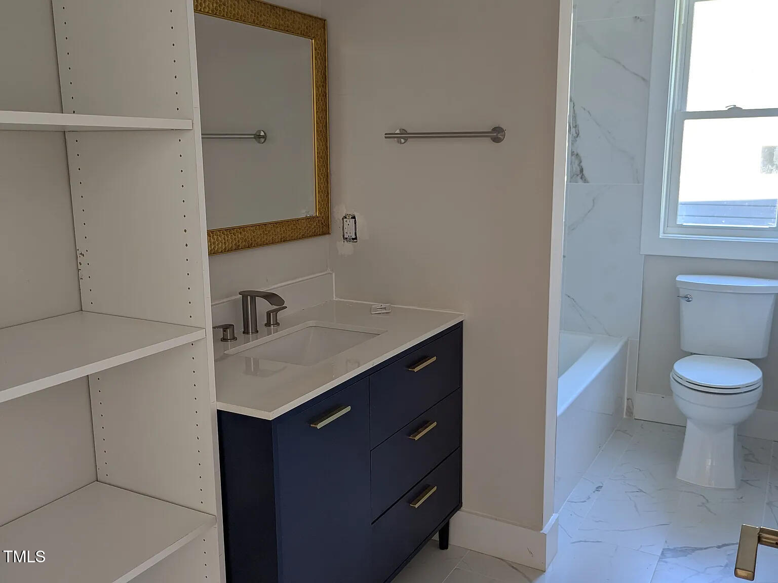 169 Prospect Avenue Raleigh, NC 27603 - Photo 16 of 23 a bathroom with a sink toilet vanity and window