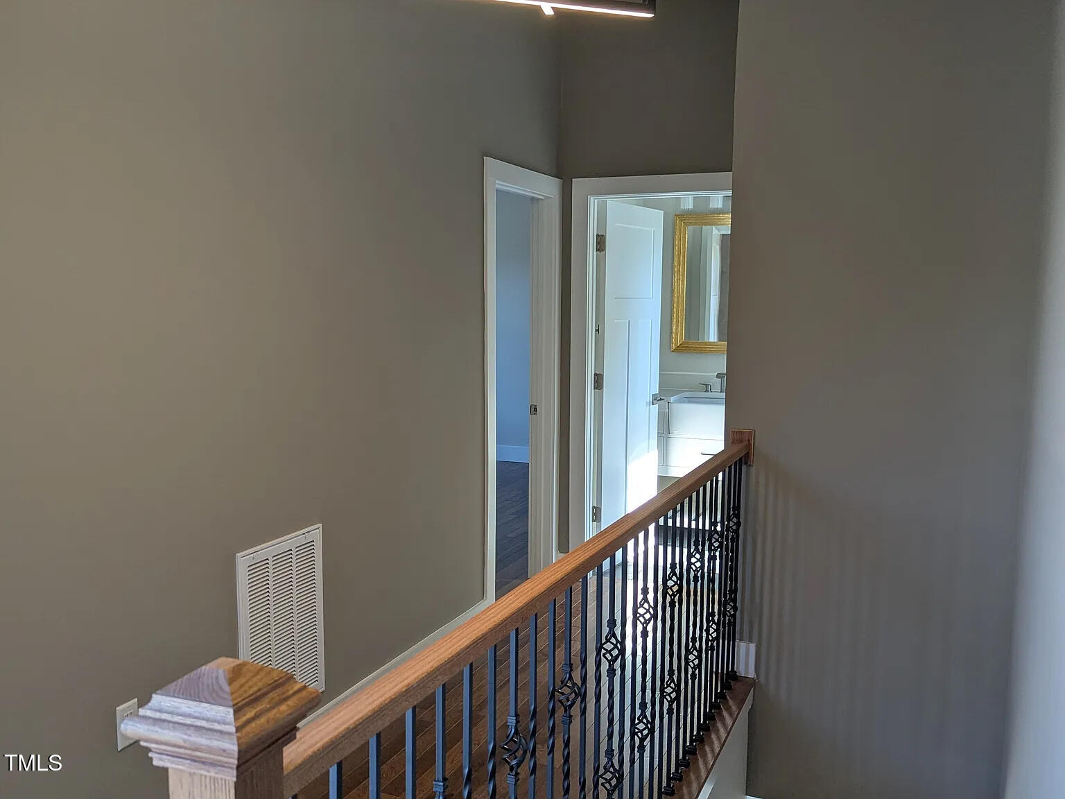 169 Prospect Avenue Raleigh, NC 27603 - Photo 17 of 23 a view of a hallway with wooden floor and staircase